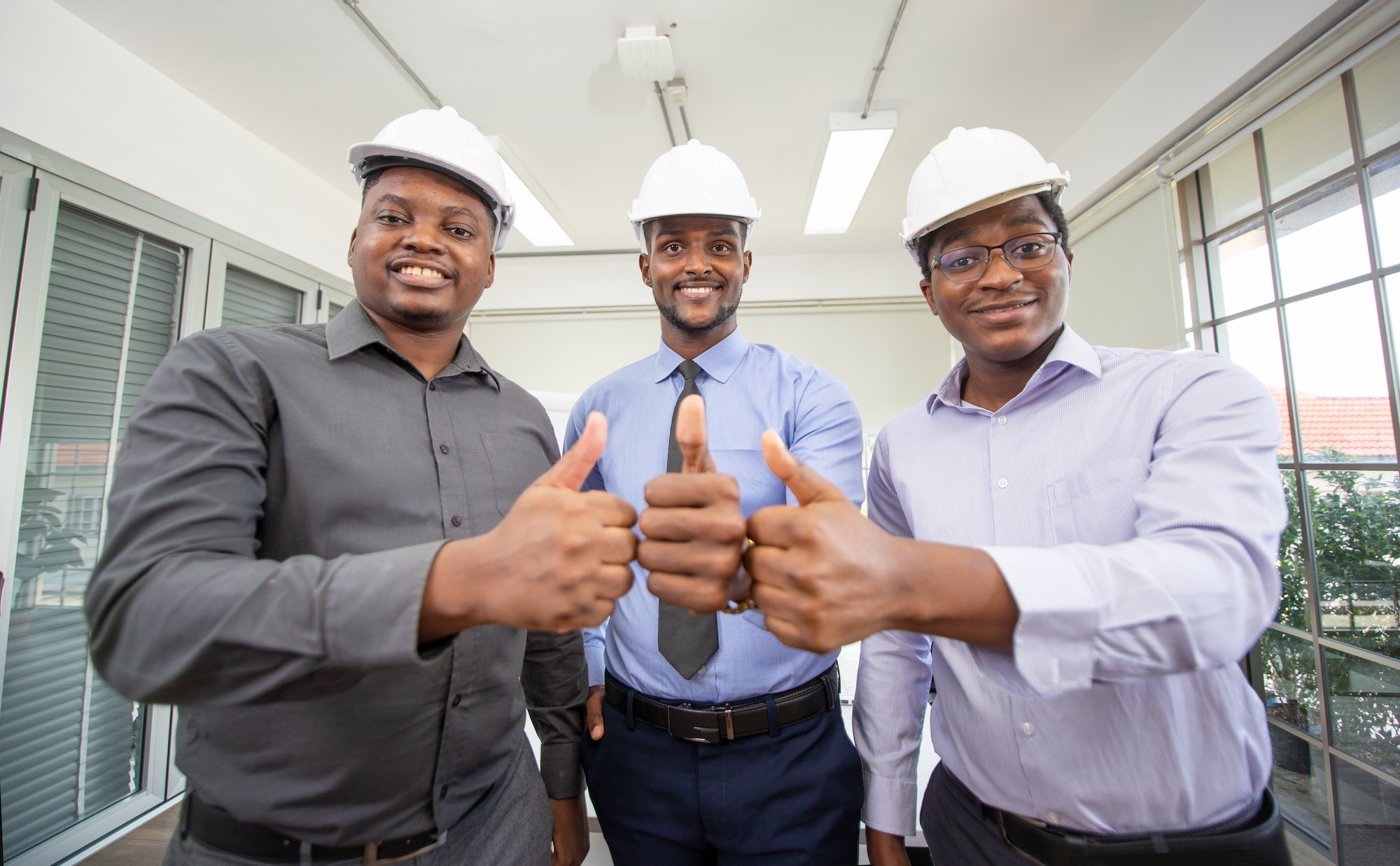 team engineer give thumb up in office